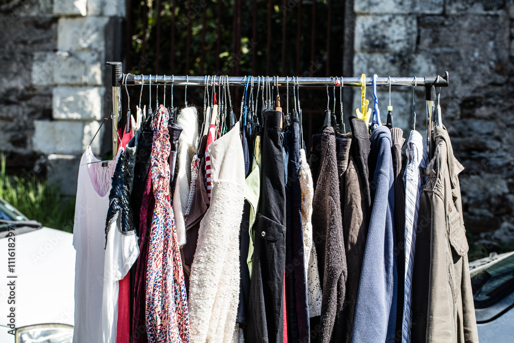 rack of old fashioned women's clothes at garage sale rack of old fashioned women's clothes at garage sale