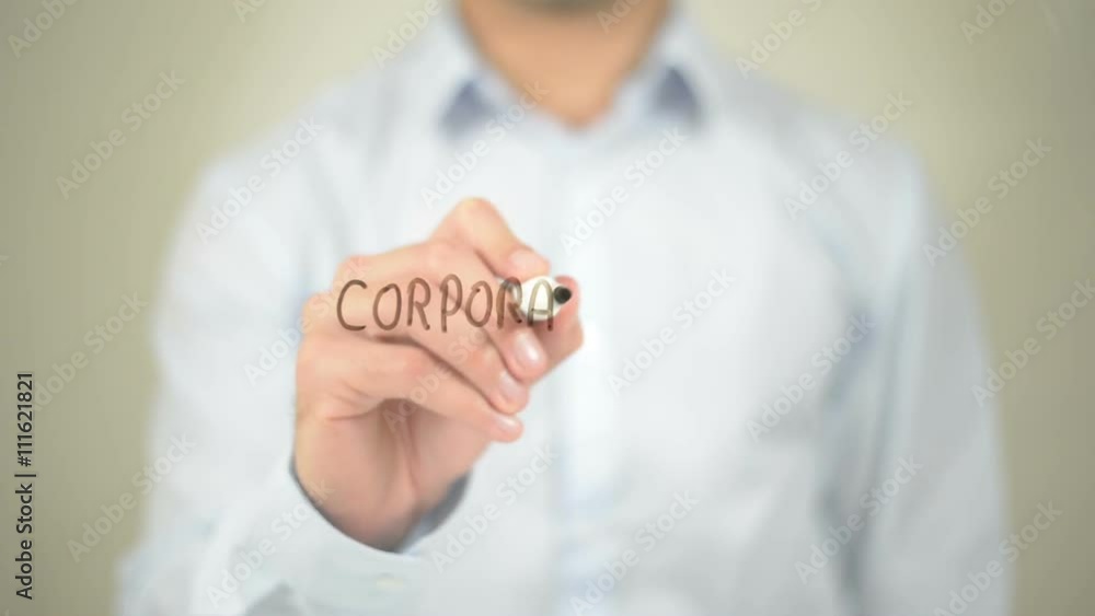 Corporate Law, man writing on transparent screen Corporate Law, man writing on transparent screen