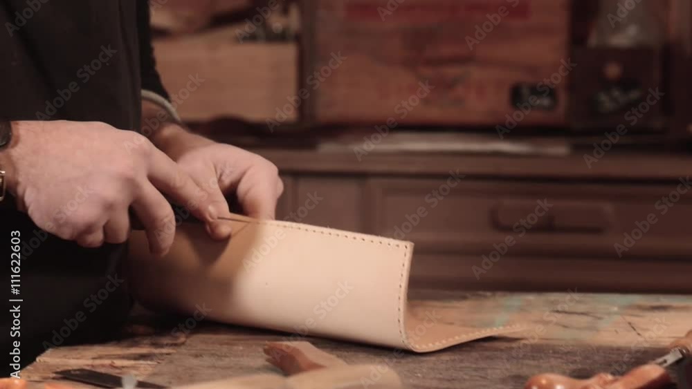 Leather goods craftsman at work in his workshop, France-Sewing machine and reels son Leather goods craftsman at work in his workshop, France-Sewing machine and reels son