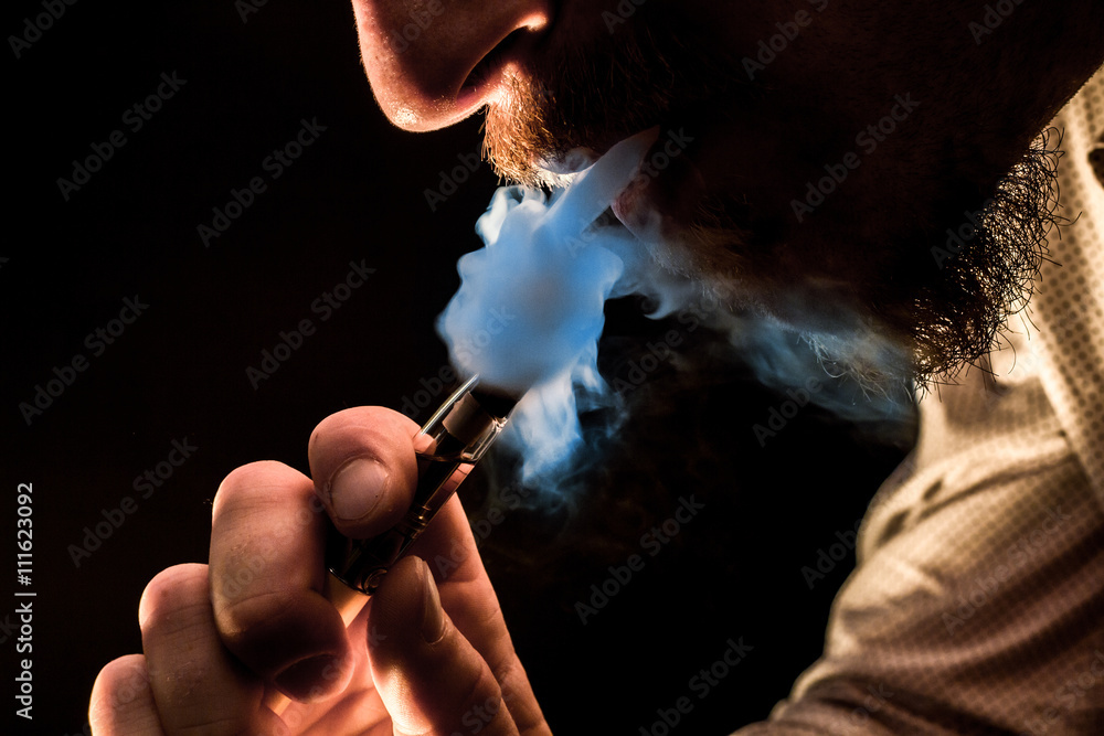 Fototapeta premium Vaping Bearded Man