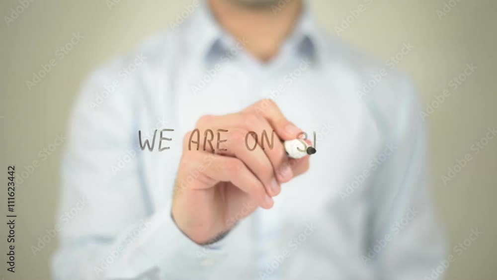 We Are On Strike , man writing on transparent screen We Are On Strike , man writing on transparent screen