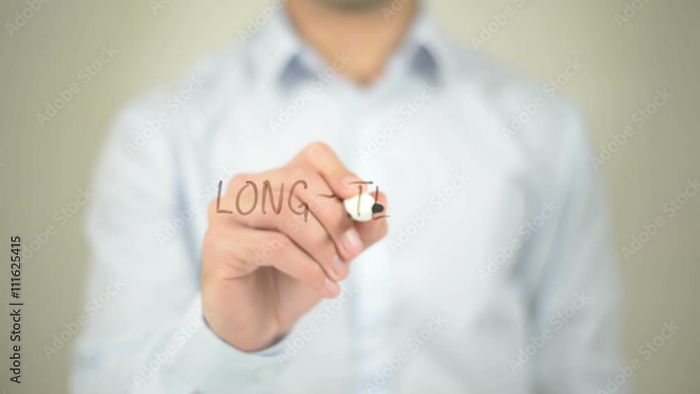 Long-Term , man writing on transparent screen Long-Term , man writing on transparent screen