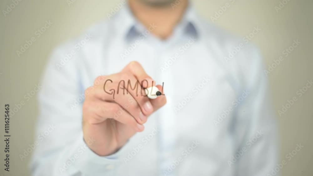 Gambling , man writing on transparent screen Gambling , man writing on transparent screen
