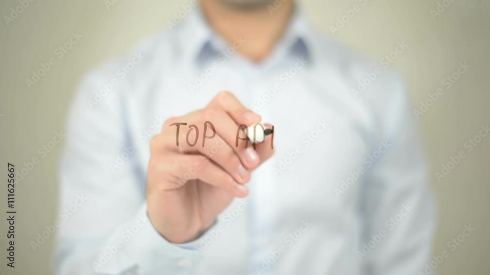 Top Apps , man writing on transparent screen Top Apps , man writing on transparent screen