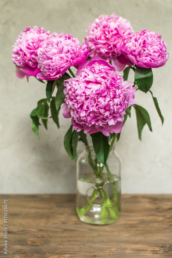 lush pink peonies in vase lush pink peonies in vase