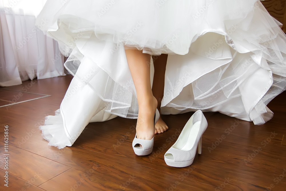 Elegant floor-length wedding dress. Concept of bride morning Elegant floor-length wedding dress. Concept of bride morning