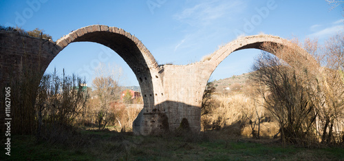  remains of medieval bridge   in Cardona. Catalonia, Spain photo