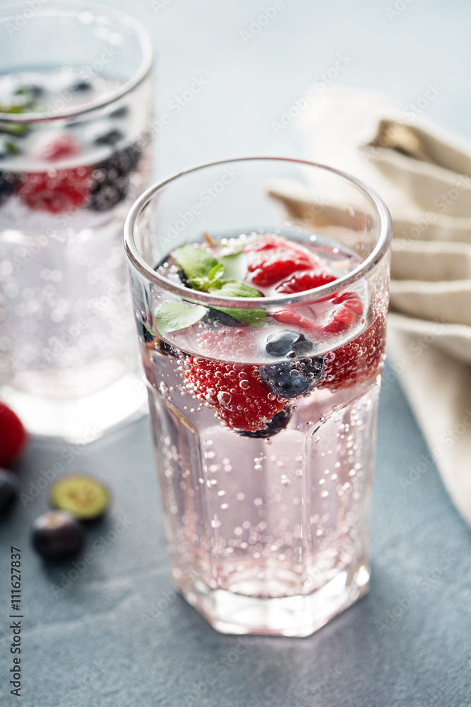 Sparkling water with raspberries and blueberries Sparkling water with raspberries and blueberries
