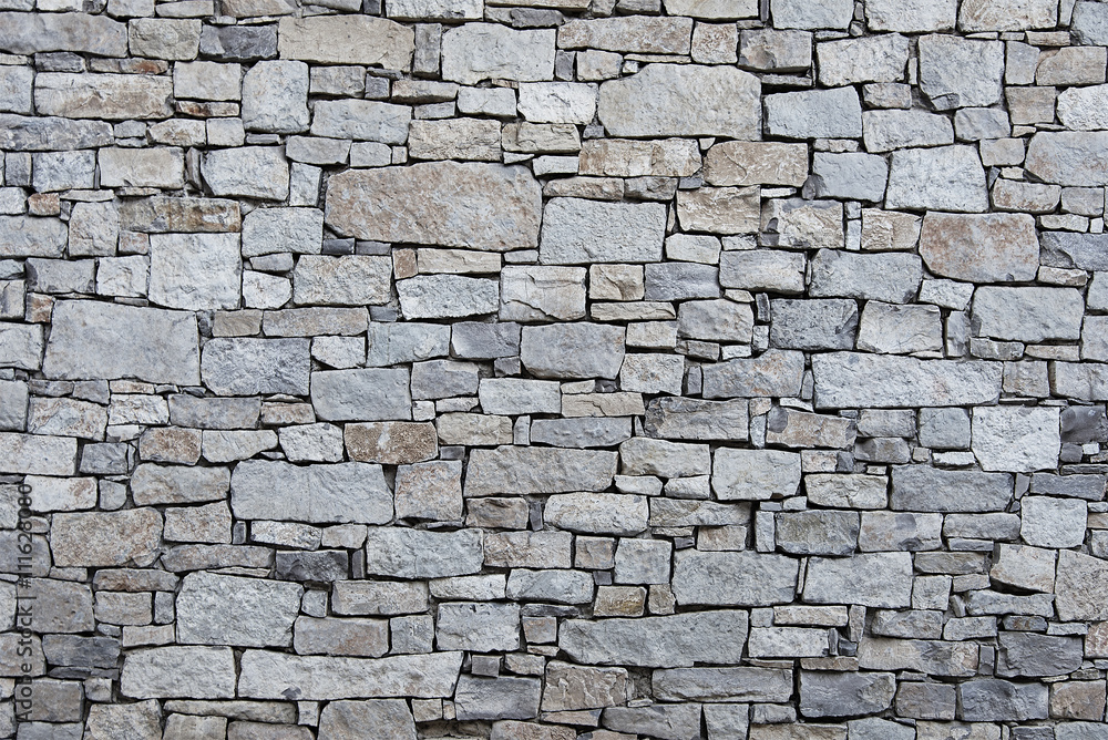 Naklejka Stara popielata kamiennej ściany tła tekstura