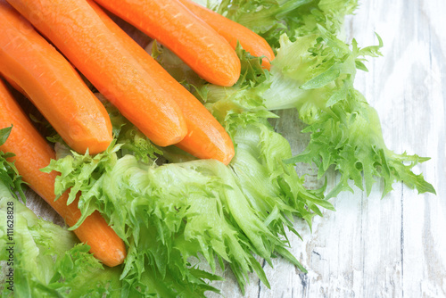 Raw peeled carrots and lettuce