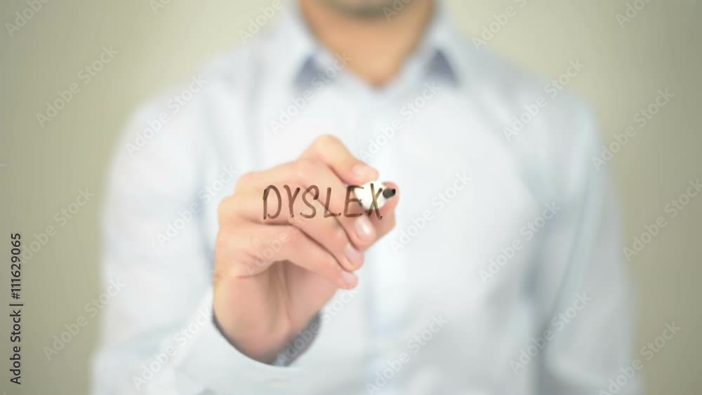 Dyslexia , man writing on transparent screen Dyslexia , man writing on transparent screen