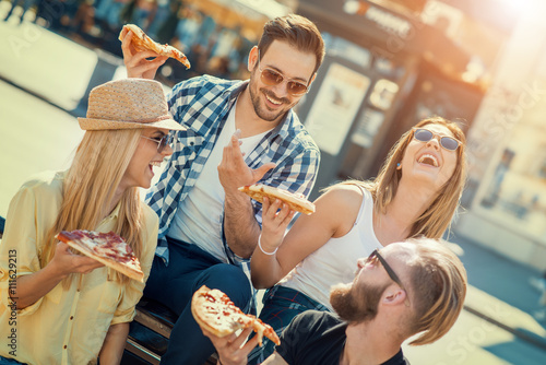 Friends eating pizza © ivanko80