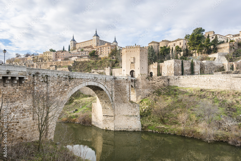 Ancient bridge in Toledo, Tagus River. Spain. 