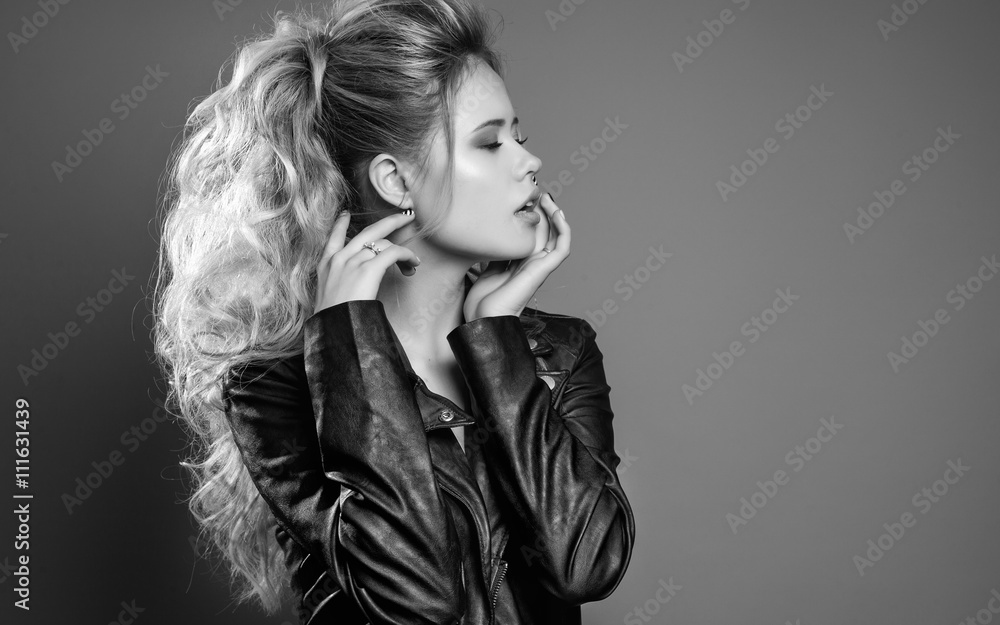 Fashion Portrait of attractive long hair nlond young woman in bl