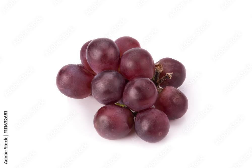 Ripe red grape with leaves isolated on white
