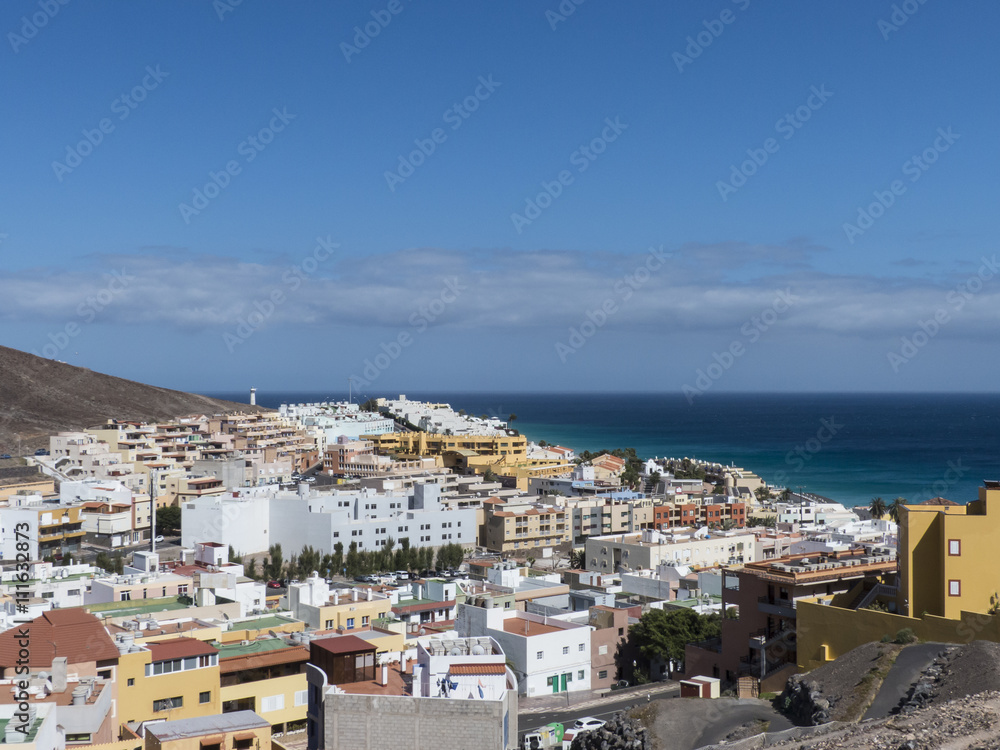 Ocean village at a mountain slope Fuerteventura.