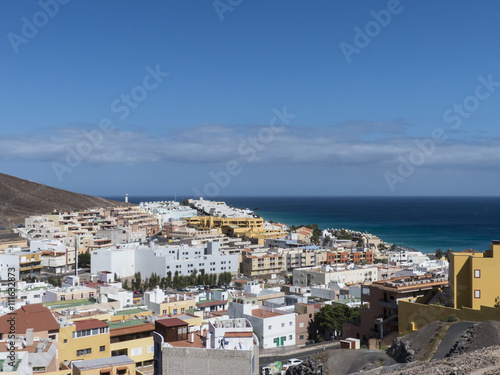 Ocean village at a mountain slope Fuerteventura.