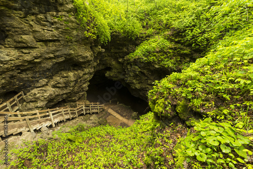 Stairs To Cave / A set of stairs leading to a cave entrance. photo