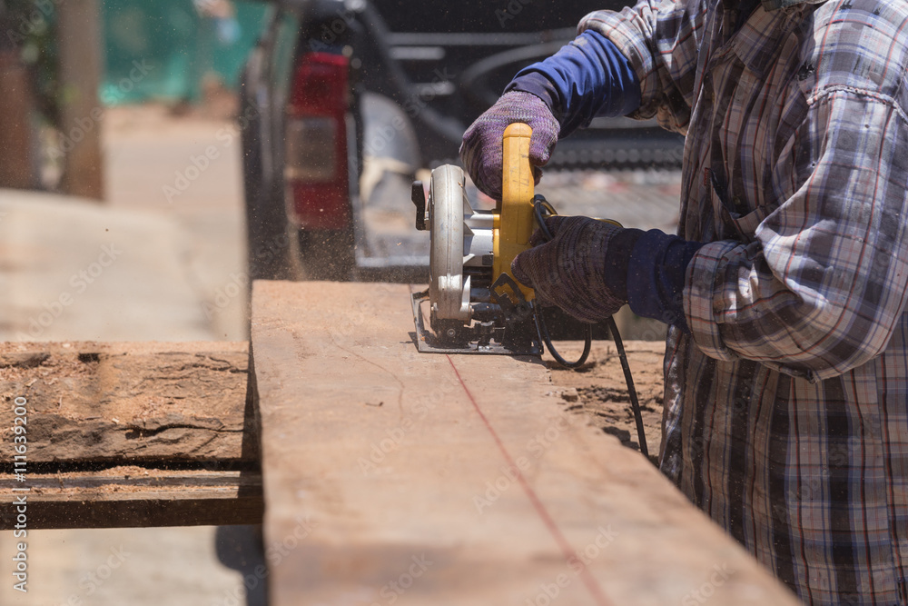 carpenter use electric saw to sawing wood carpenter use electric saw to sawing wood