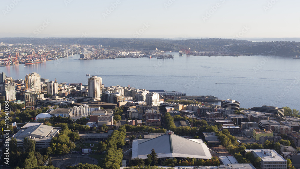 Obraz premium Urban Downtown City Aerial Panoramic View. Scenic Northwest Buildings like Key Arena, Waterfront Elliot Bay Background