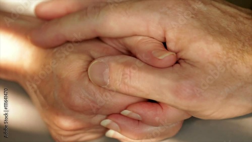 The hands and fingers of an older woman expressing anxiety or worry.