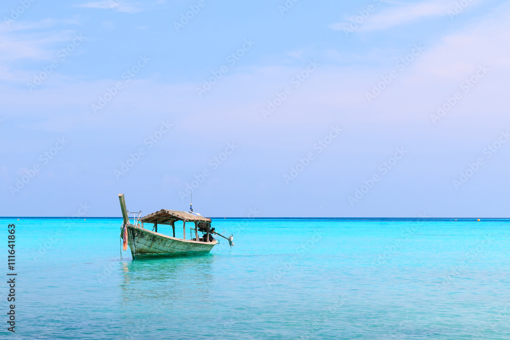 old wood boat,blue sea,space for your text