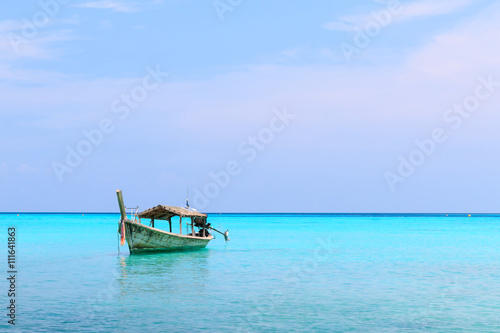 old wood boat,blue sea,space for your text © Atip R