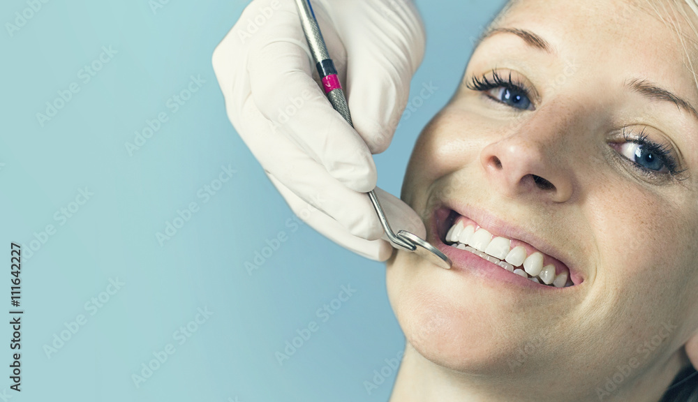 Woman receiving a dental check up from her dentist