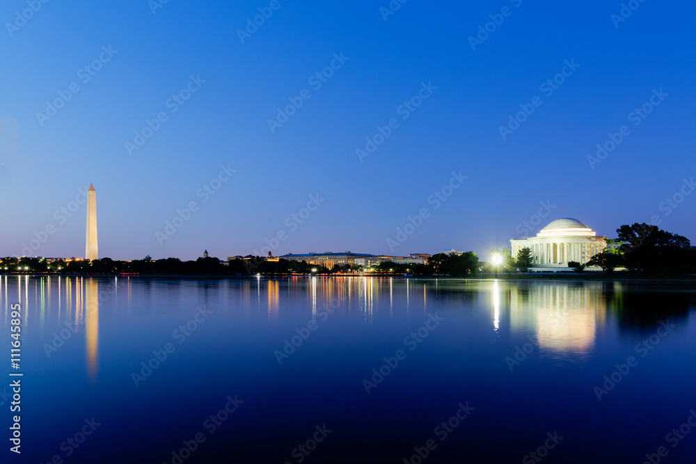 Jefferson Memorial and Washington Monument across the tidal basin at dusk during the blue hour