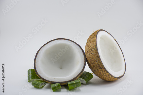 Coconut isolated on coconut leave on white background.