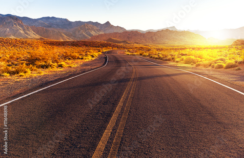 Fotografie Red sunset over road at Valley of Fire State Park, southern Nevada, USA