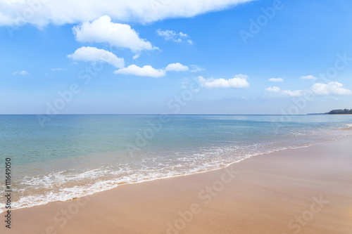 Empty tropical beach and sea with white cloud and blue sky in Thailand
