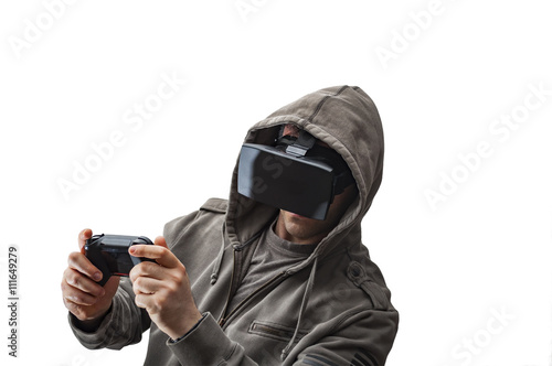 Caucasian man wearing a hoodie and Virtual reality ( VR ) headset is presumably as gamer enjoying a video game or a hacker cracking the code into a secure network or server, isolated on white
