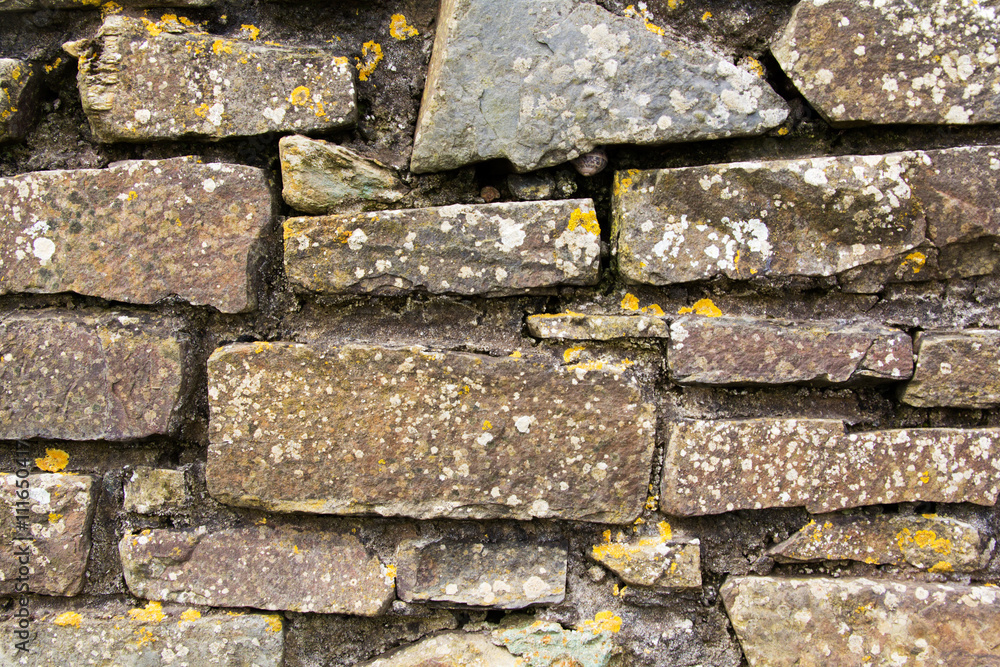 Close up of an old rustic looking stone wall Close up of an old rustic looking stone wall