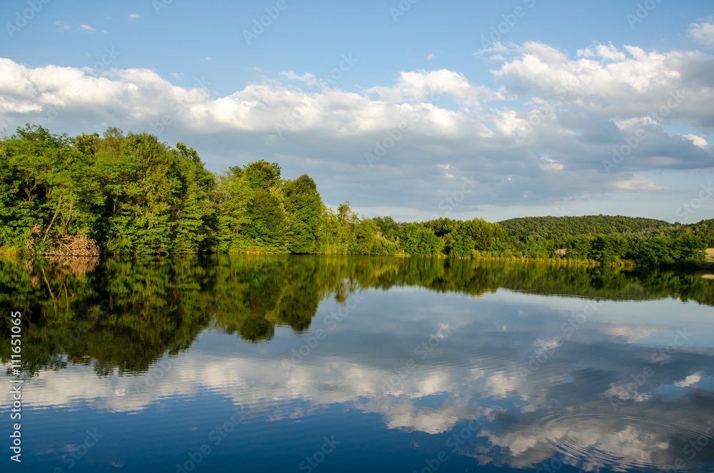 Mountain Lake with blue mountains in the background Mountain Lake with blue mountains in the background