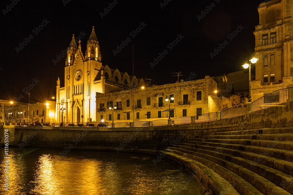 Church of Our Lady and Mount Carmela and Balluta Bay in San Juliens, Malta.