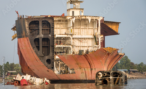 Partially broken down ocean ship at a shipbreaking yard in Chittagong, Bangladesh photo