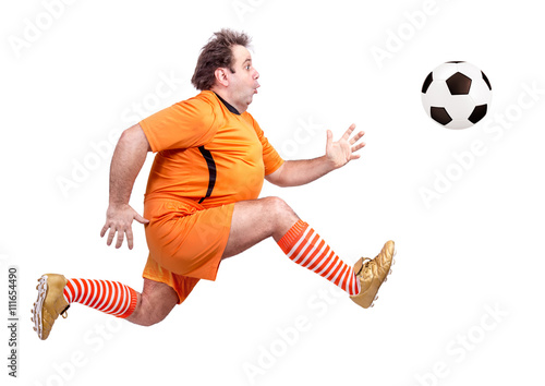 recreational fat football player kicking the ball isolated on a white background
