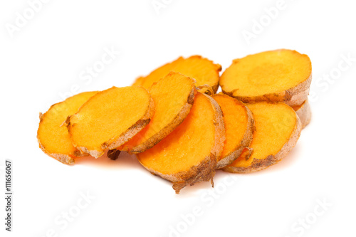 Collection of sliced fresh Organic Long Turmeric or Haldi (Curcuma longa) isolated on white background.