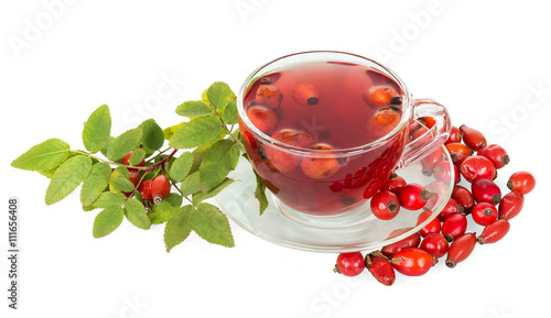 Rosehip berries, cup of tea isolated on white background.