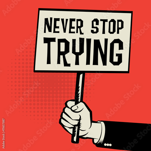 Poster in hand, business concept with text Never Stop Trying
