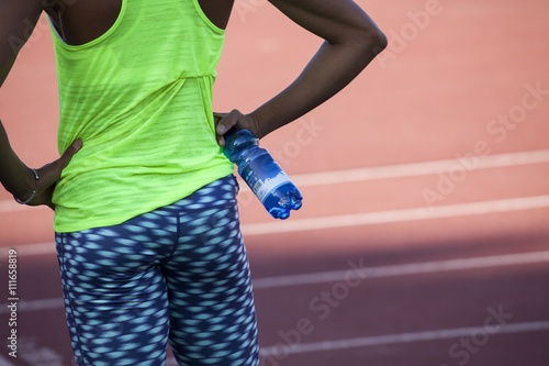 Athlete young woman refreshs her body