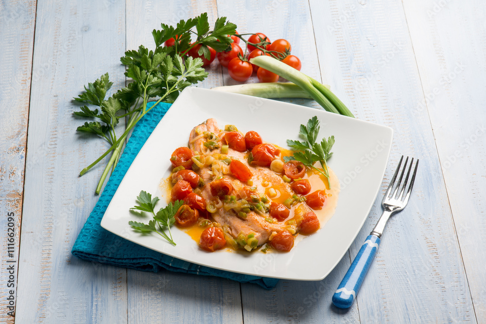 salmon trout fillet with leek and fresh tomatoes salmon trout fillet with leek and fresh tomatoes