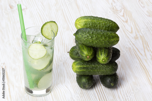 Summer cucumber cocktail and cucumbers.