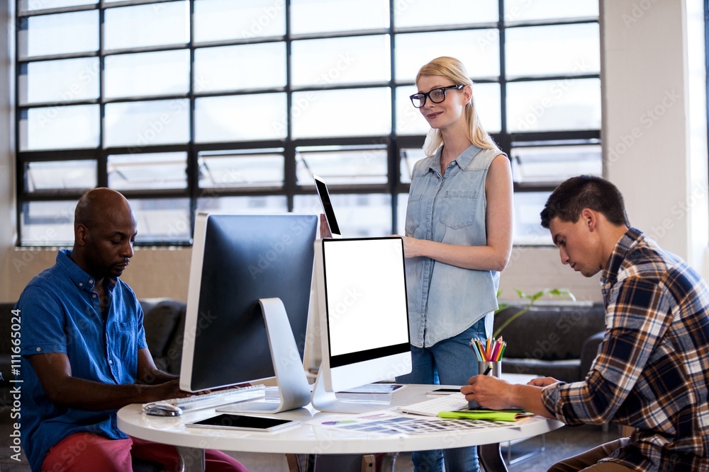 Team of business people working together in office Team of business people working together in office