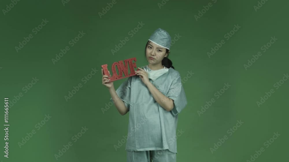young asian adult woman doctor surgeon isolated on green-screen background sadness love romance young asian adult woman doctor surgeon isolated on green-screen background sadness love romance