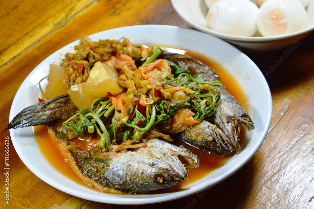 deep fried striped snake head fish in mixed hot and sour soup eat with boiled egg deep fried striped snake head fish in mixed hot and sour soup eat with boiled egg
