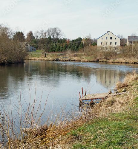 Jetty at a pastoral river, Siedlecin, Silesia, Poland photo