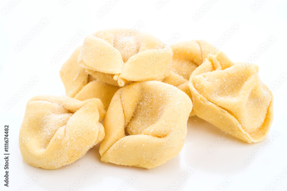 uncooked tortellini isolated on white uncooked tortellini isolated on white