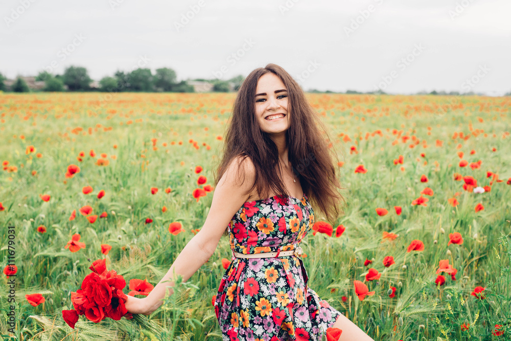 young beautiful woman having fun in poppy field young beautiful woman having fun in poppy field